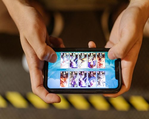 Smartphone displaying the fictional Crown Prism Journey game on CrownGameVision Australia